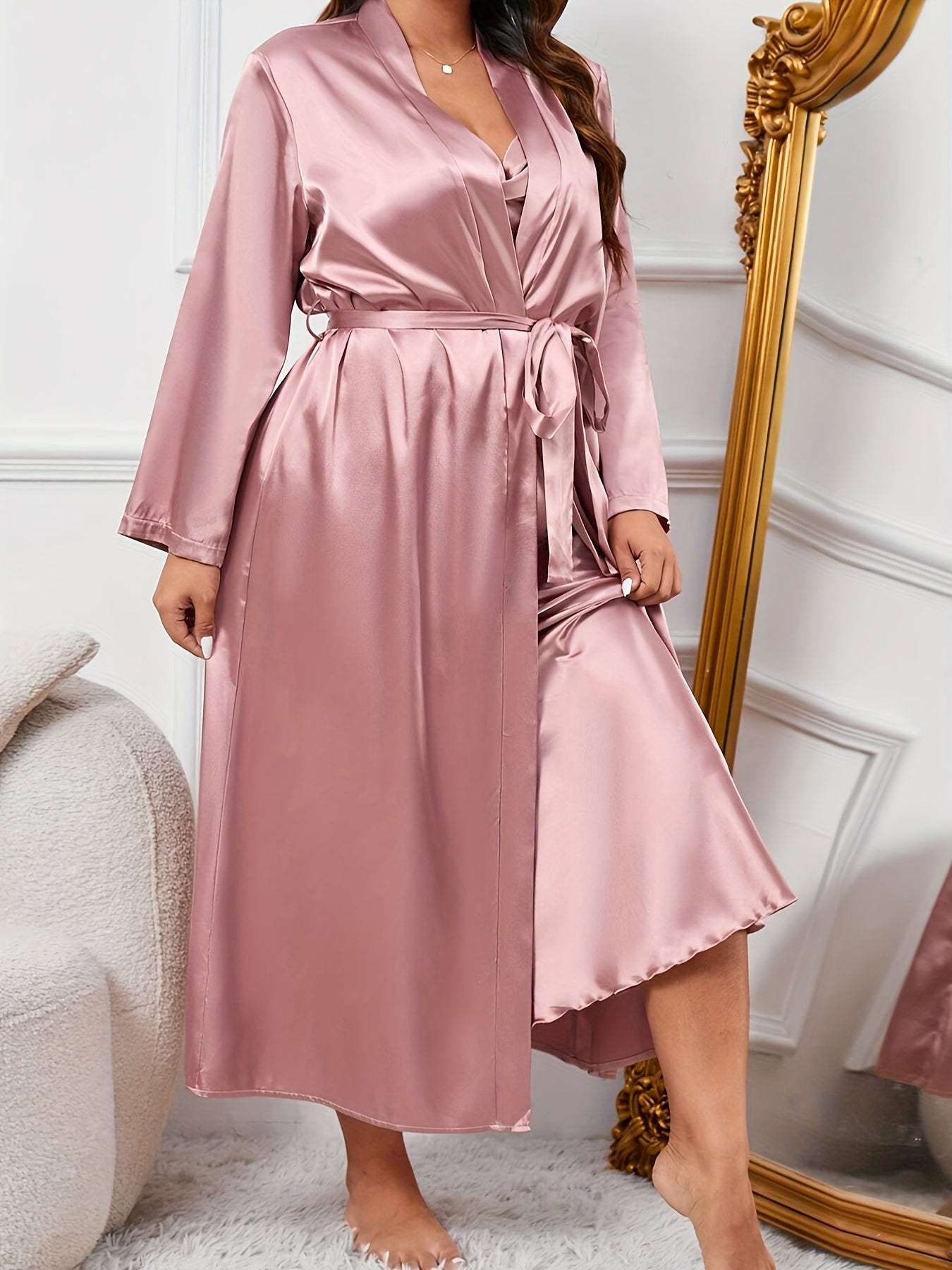 Elegant satin pajama set for plus size women, including slip dress and robe with belt. Perfect for fall and winter.