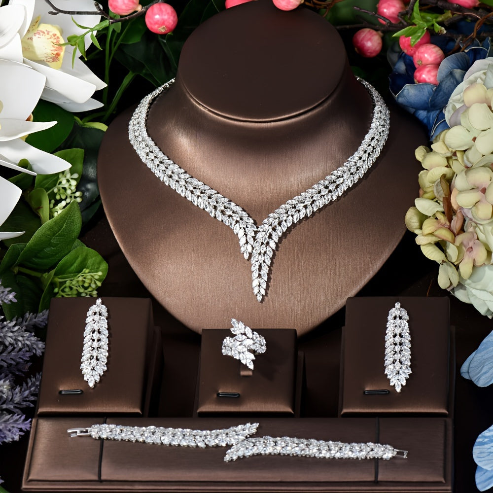 Elegant Leaf-Shaped Jewelry Set with Sparkling Zirconia, 18K Gold Plated Copper. Includes Earrings, Necklace, Bracelet, and Ring. Perfect for Weddings, Parties, and Bridal Wear.