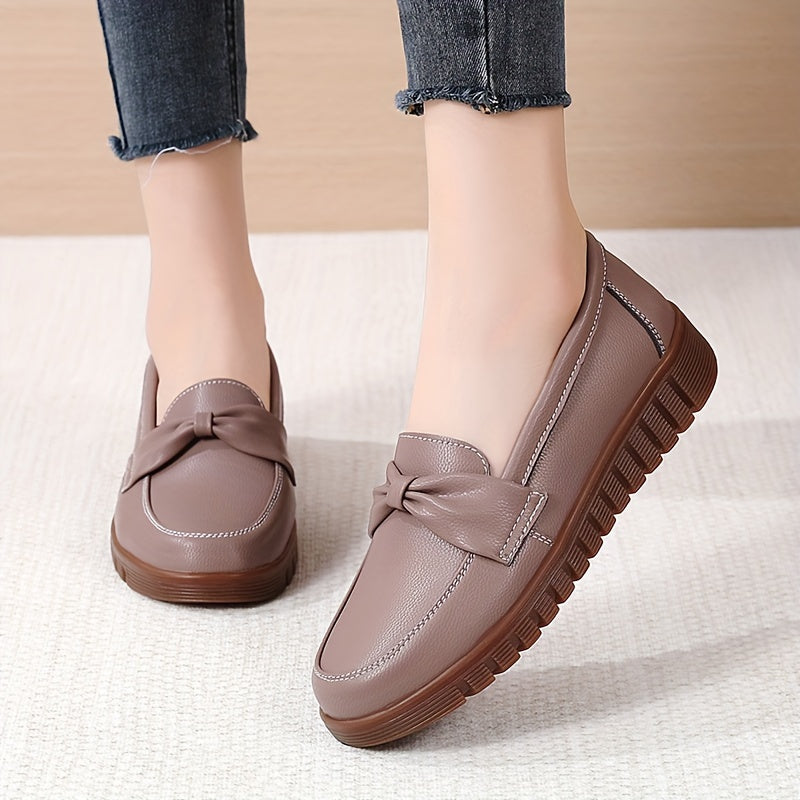 Women's comfortable penny loafers with bow embellishment, non-slip sole, round toe, all-season footwear, man-made materials, TPR sole.