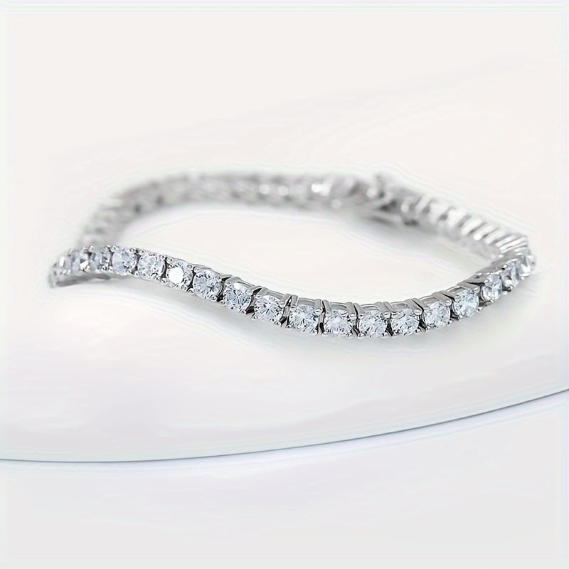 A luxury Mozambique Stone tennis bracelet with a stunning 10.5-14 carats laboratory-created simulated diamond design made specifically for women. This exquisite bracelet is made with 18k white golden plated 925 sterling silver. The 5mm D color VVS1 round