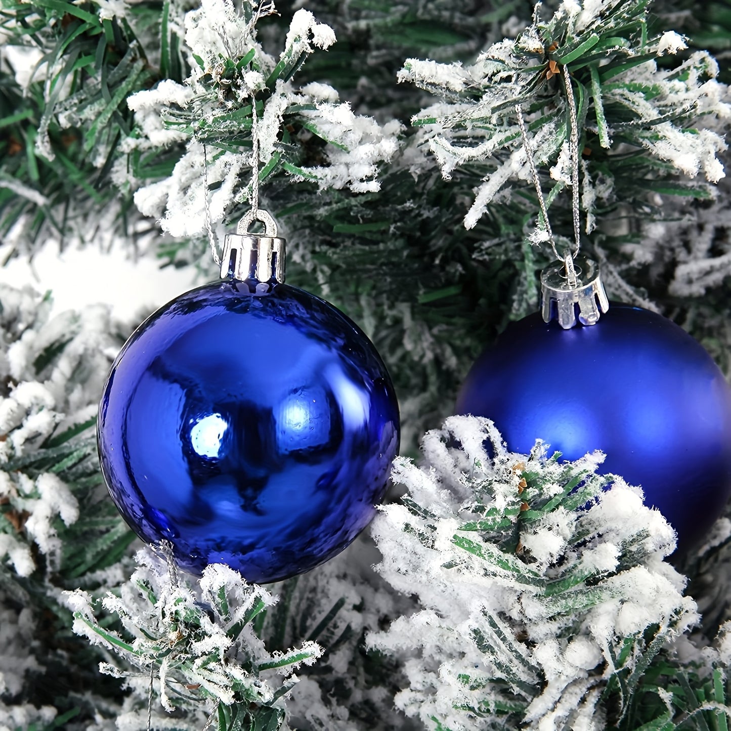 24 shatterproof Christmas tree ornaments in various sizes for festive decorations.