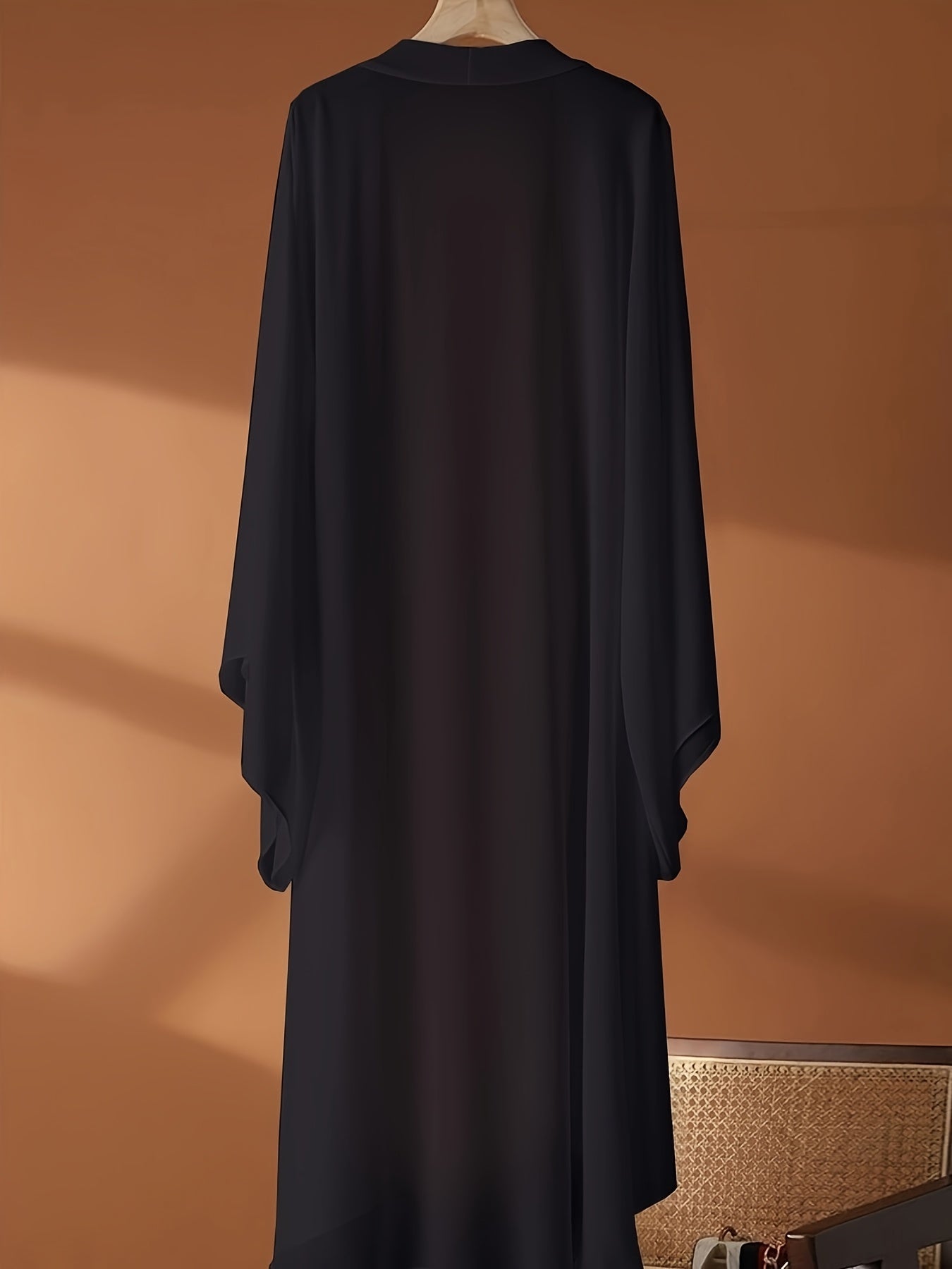 Plus Size Long Sheer Kimono Cardigan made of polyester knit fabric, featuring a solid color design and non-stretch material. This elegant and lightweight outerwear is perfect for casual