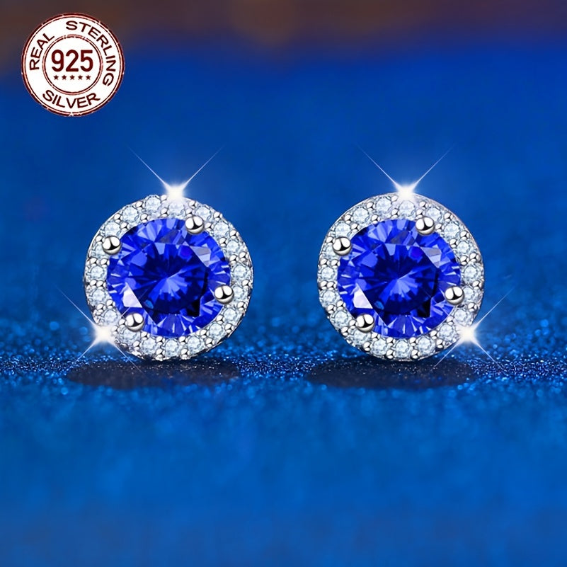 A beautiful pair of royal blue Tanzanite stud earrings in an elegant vintage style. Made from 925 sterling silver and featuring synthetic stones, these earrings are hypoallergenic and perfect for special occasions like weddings, gifting, Valentine's Day