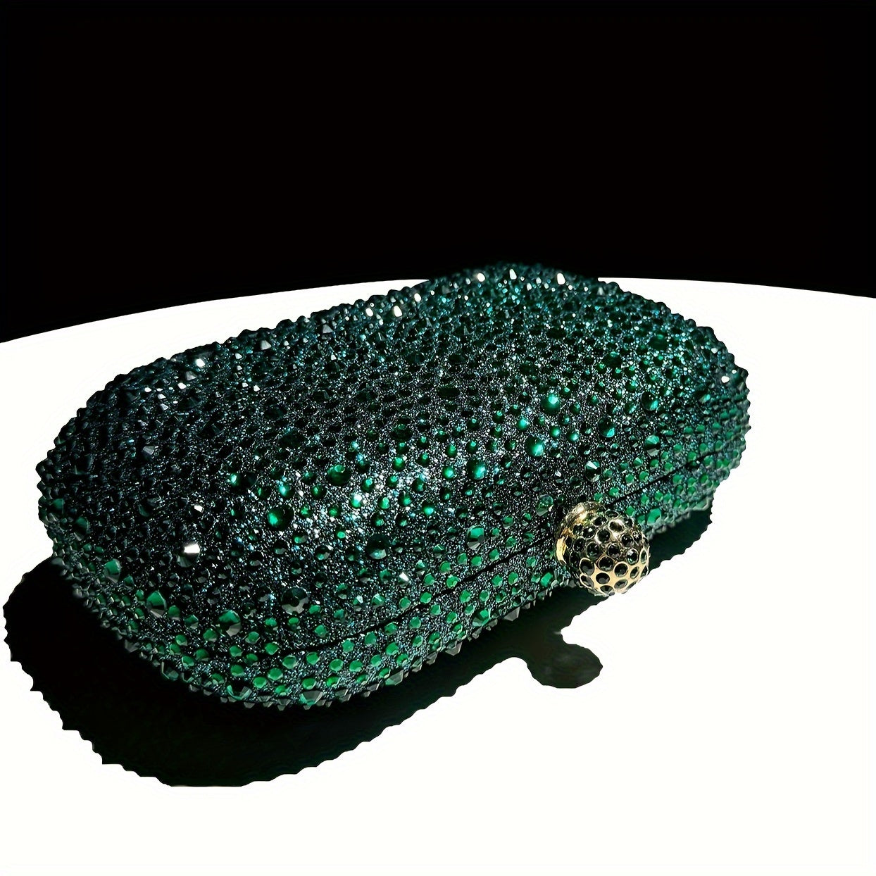 Stylish emerald green handbag with golden chain, suitable for formal events and as a gift for women.