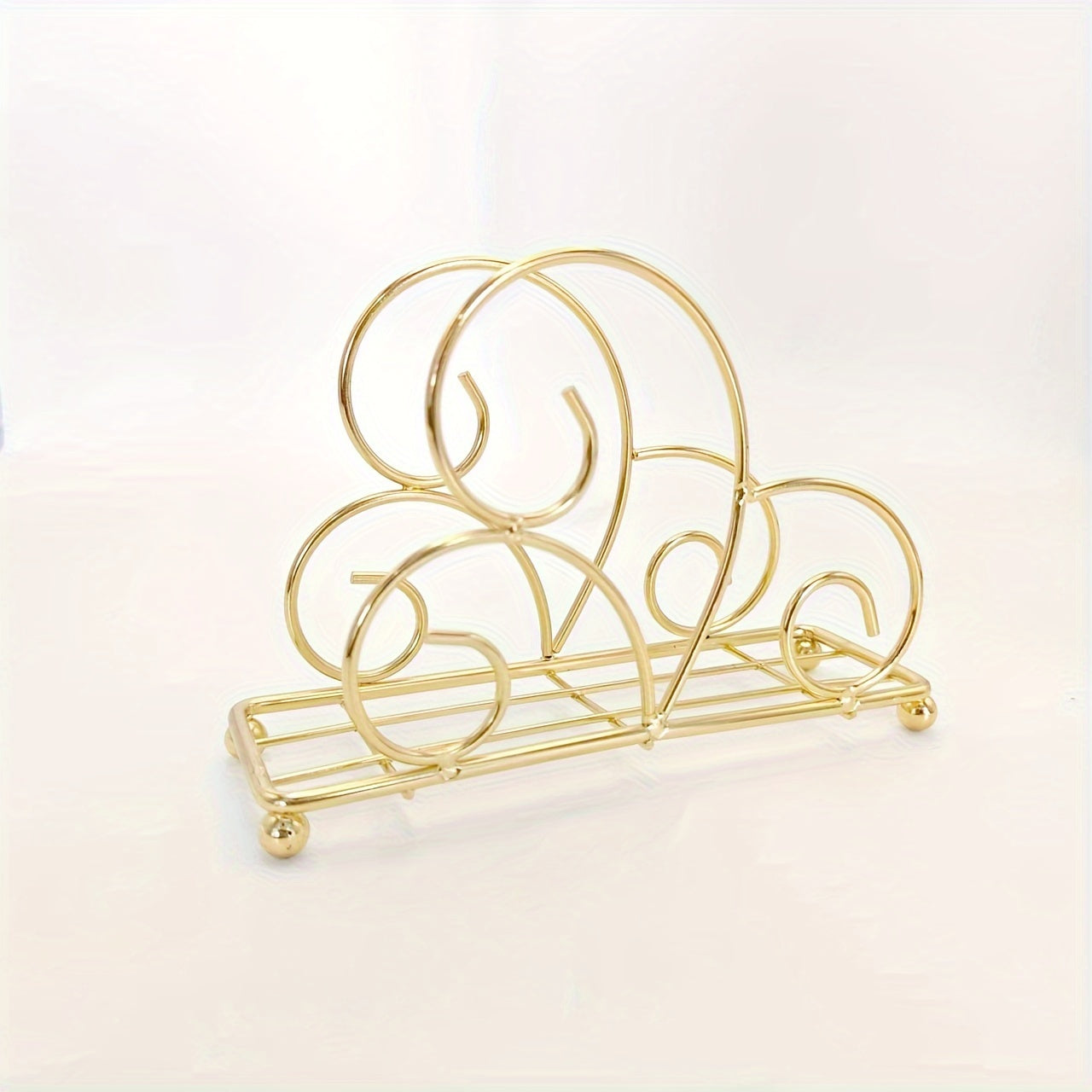 One metal cartoon tree-shaped napkin holder with hollow-out design for kitchen or dining table decoration, made of cast iron.