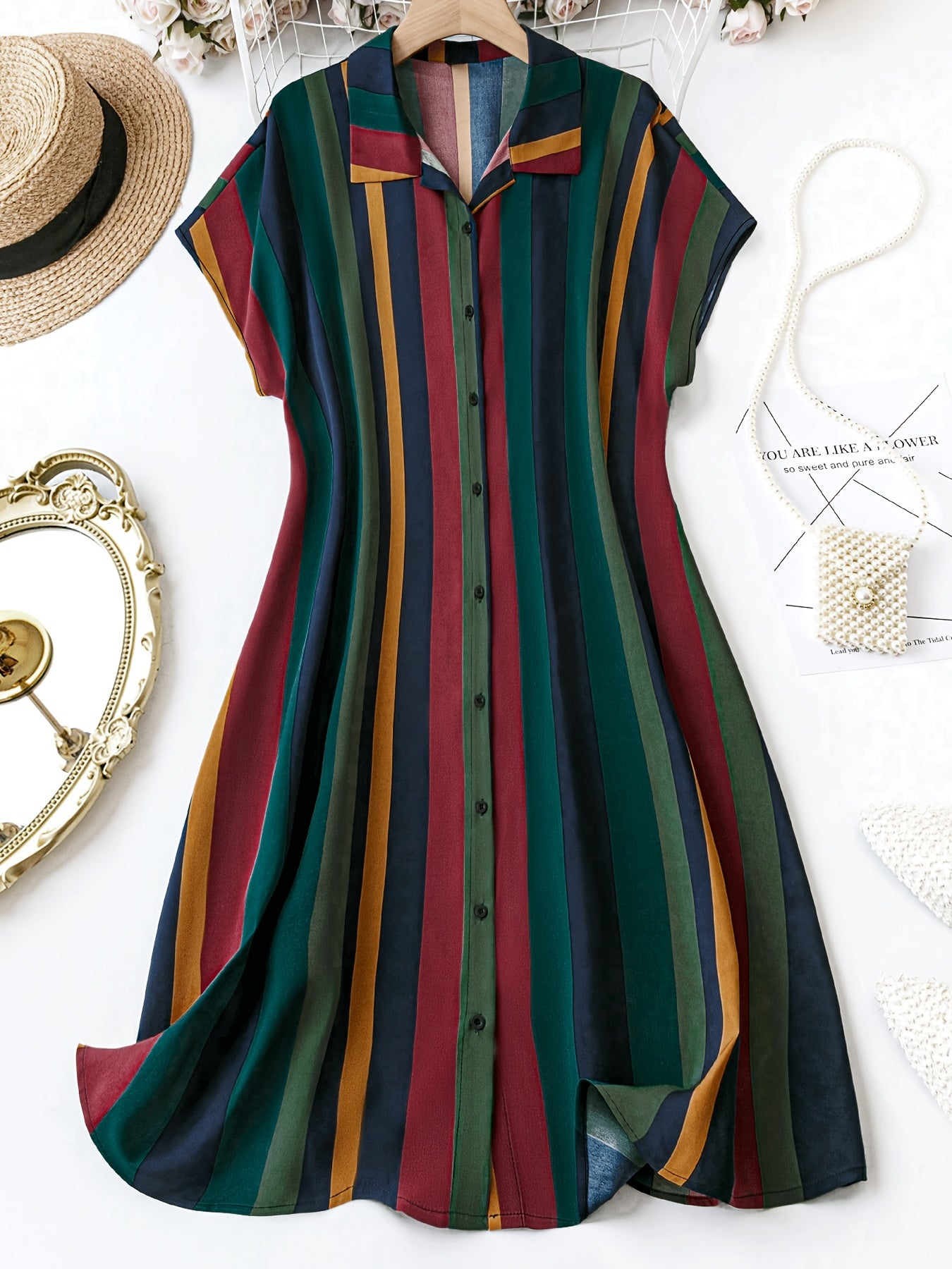 Elegant button-front dress for spring & summer featuring stripe print color block, short sleeves, and collared neckline. Plus size style for women.