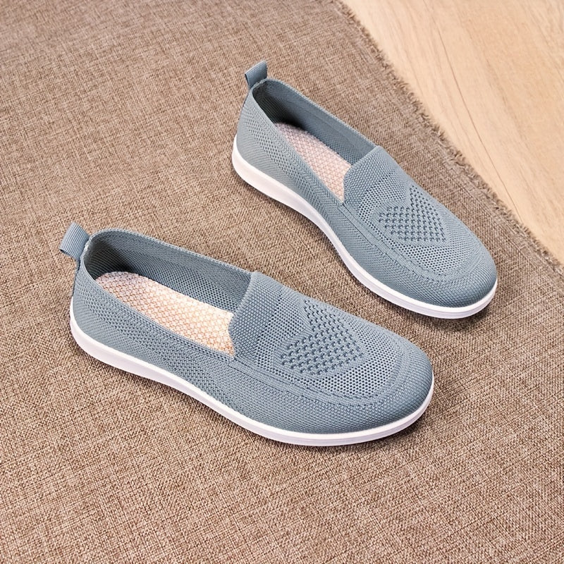 Women's slip-on flats with comfortable fabric upper, flax insole, and faux sole for easy daily wear.