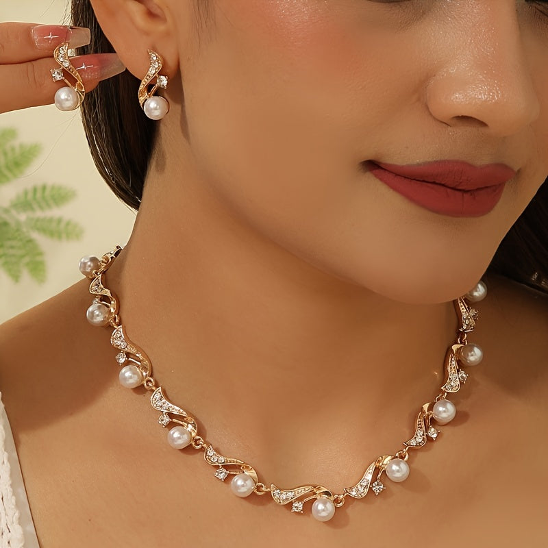 This elegant two-piece set includes a water-drilled imitation pearl necklace and matching earrings, perfect for women who love light luxury and versatility. The necklace can be worn as a sweater chain or a clavicle chain, and is adorned with golden