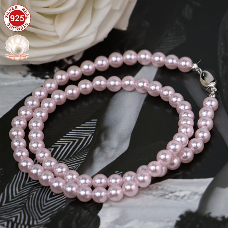 This stunning Cherry Blossom Pink Shell Pearl Necklace is crafted with hypoallergenic 925 Sterling Silver and features a vintage charm clasp. It makes the perfect gift for her and comes beautifully presented in an elegant gift box, making it ideal for