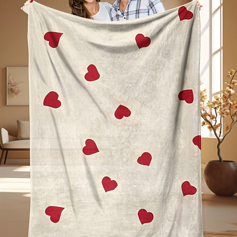 Soft sofa throw blanket featuring a red heart pattern for Valentine's Day. This cozy blanket is knit from warm polyester coral fleece and showcases a contemporary style. The digital print craftsmanship makes it perfect for use on the couch, bed, camping