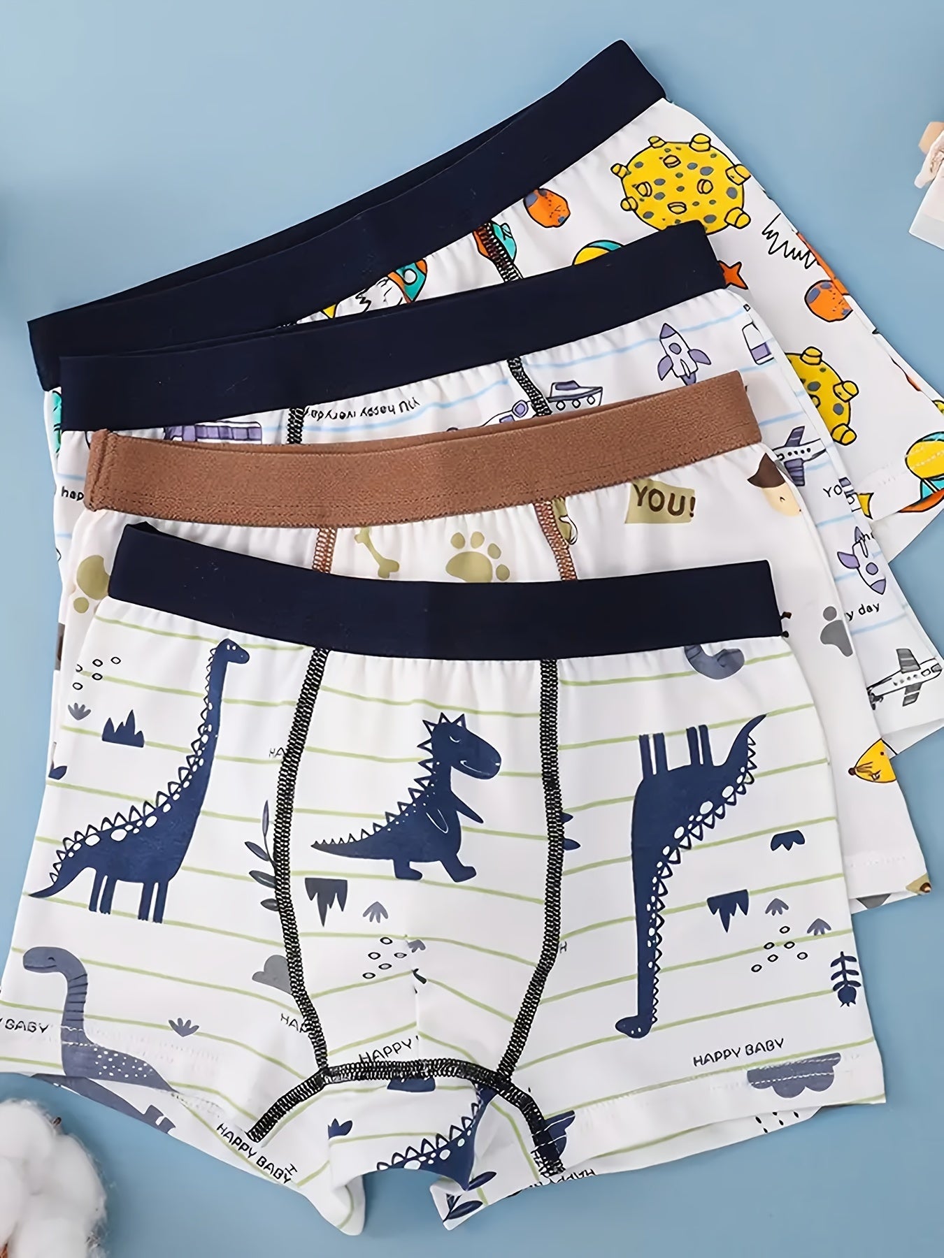 Set of 4 boys' cotton boxer briefs with cute cartoon designs, soft and breathable, ideal for all seasons.