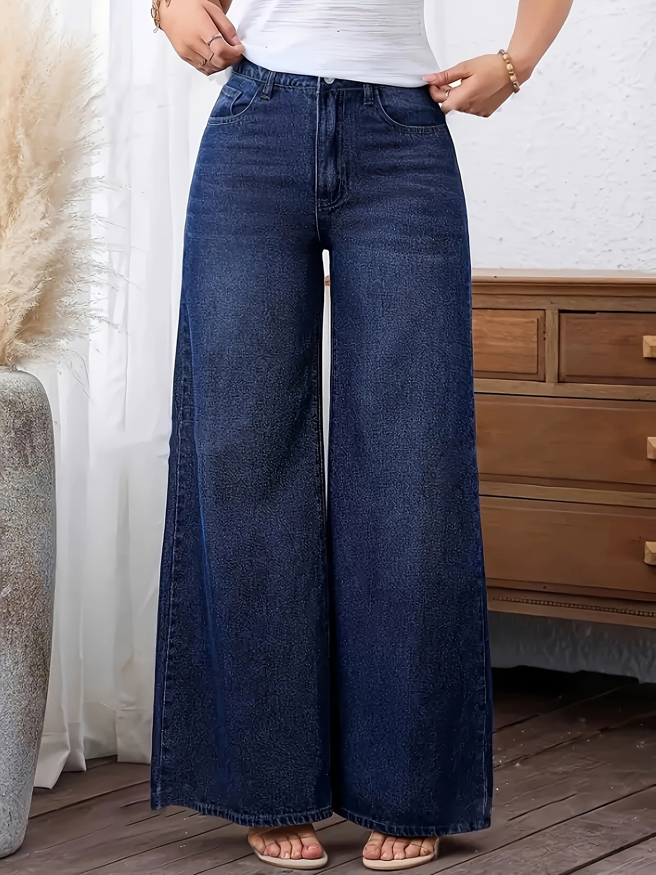 Women's plus size denim jeans with straight leg, solid color, medium stretch, washed fabric, and wide-leg design suitable for all seasons.