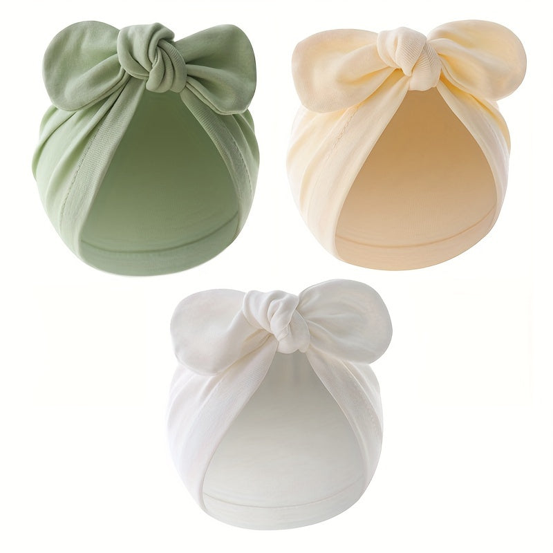 Three-pack of cotton baby turban hats with bow, suitable for newborns to 3 years old. Hand washable and lightweight, perfect for birthdays and fantasy themes.