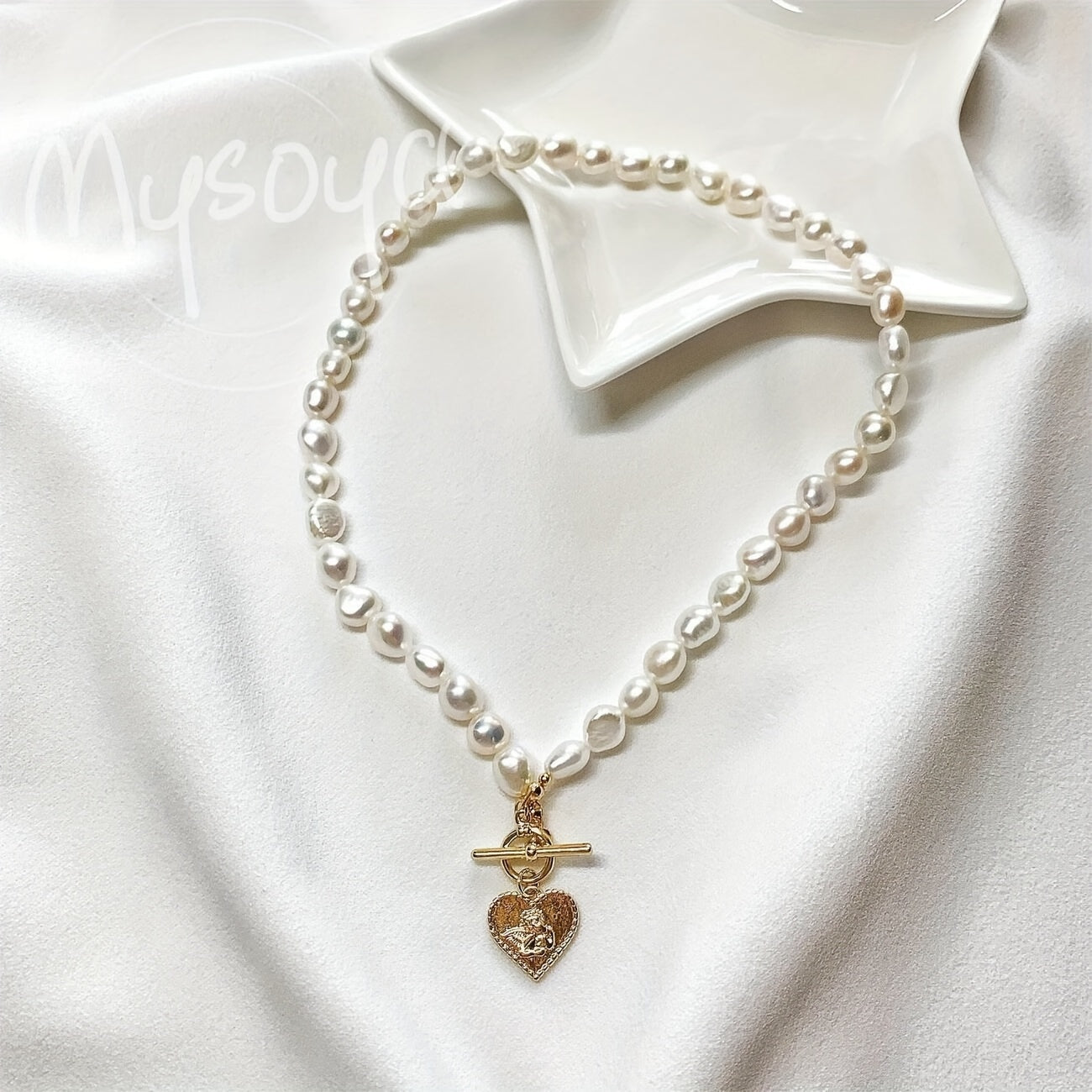 This elegant necklace features a handcrafted Baroque freshwater pearl with a golden heart pendant. Measuring 7-8mm, it comes in a beautiful gift box, making it a perfect gift for birthdays, anniversaries, Valentine's Day, and any special occasion.