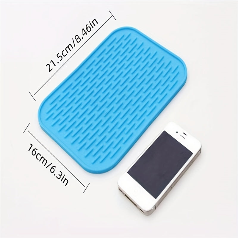 High-quality silicone drying mat for dishes, heat-resistant and non-slip, protects kitchen surfaces, versatile trivet, 21.59cm x 16.0cm, come in vibrant colors.