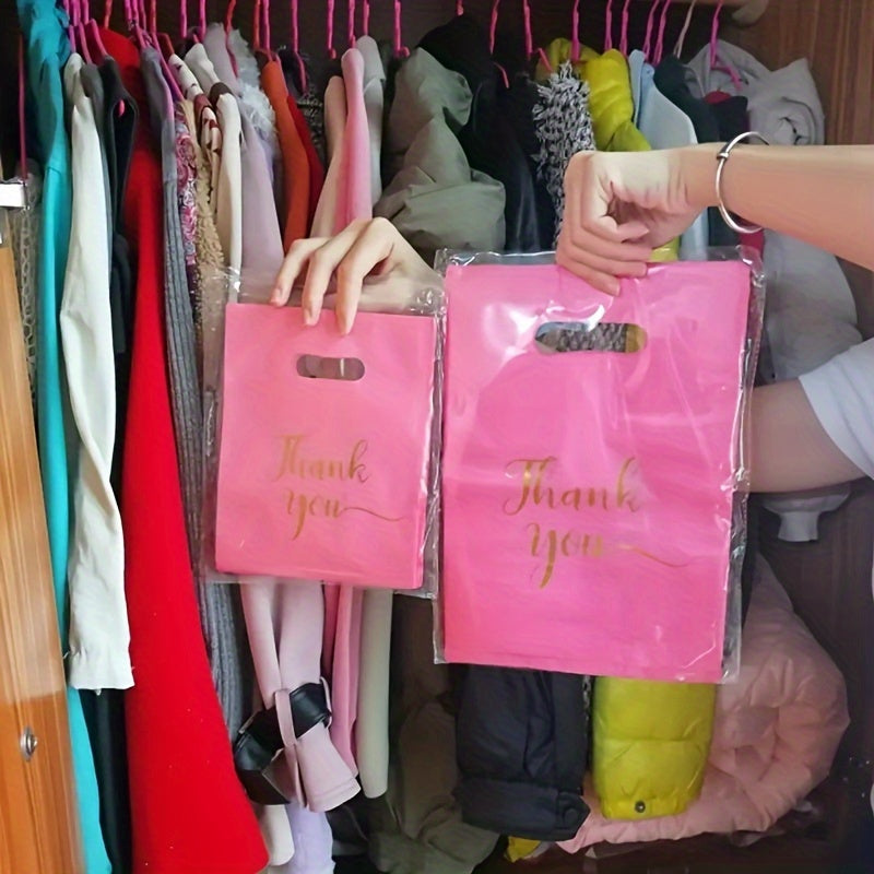 Stylish reusable plastic tote bags, ideal for retail, boutique, gifts, clothing & party favors, with elegant thank you text in black, white, and pink with golden cursive.