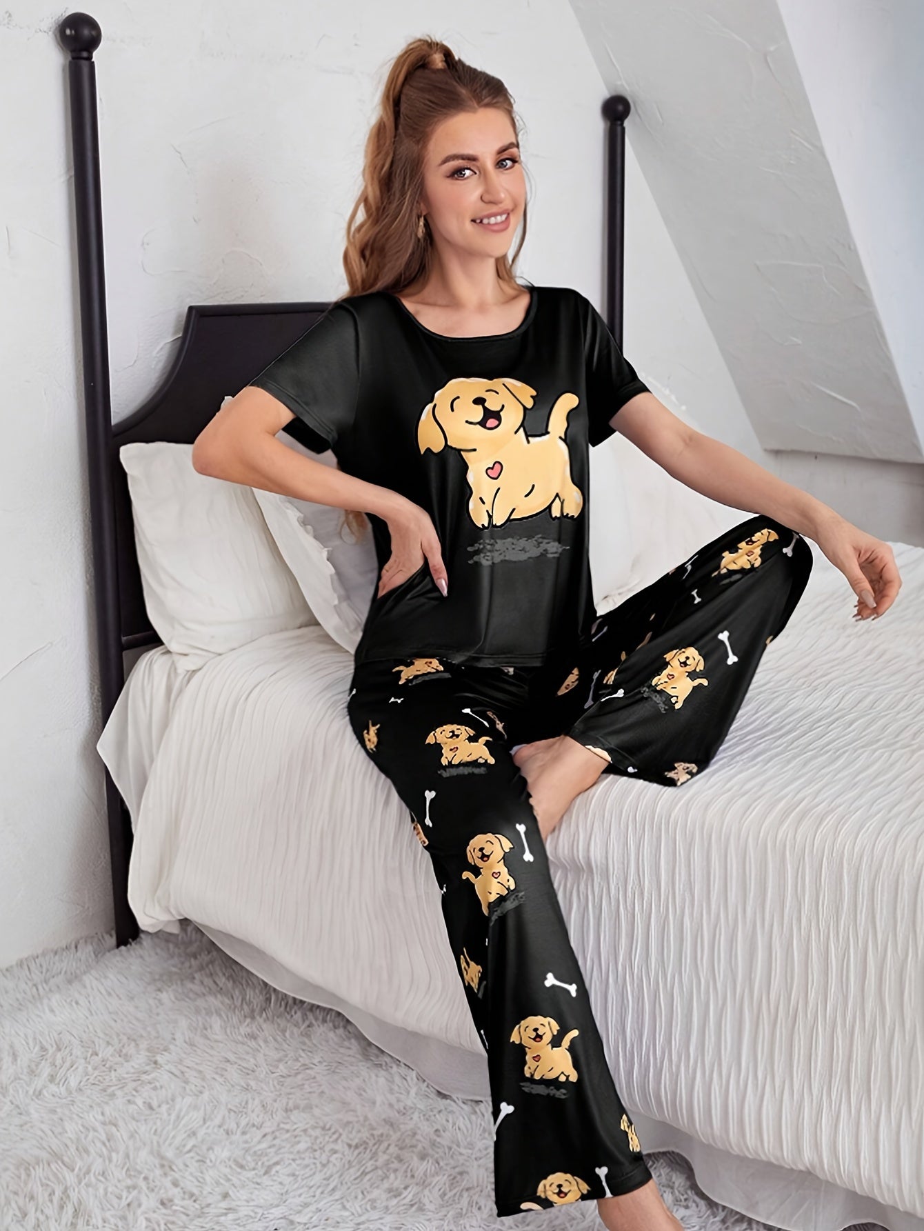 Women's sleepwear set with cute puppy print, short sleeve top, and elastic pants.