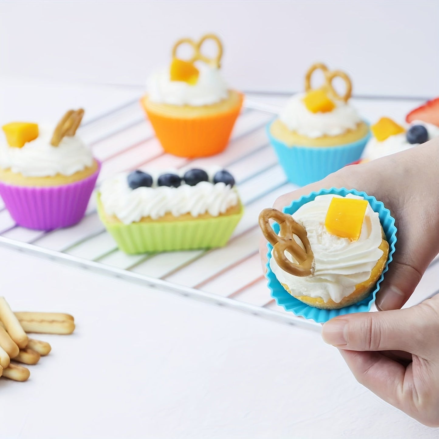 Reusable non-stick silicone baking cups for muffins and cupcakes, sold in packs of 12 or 24.