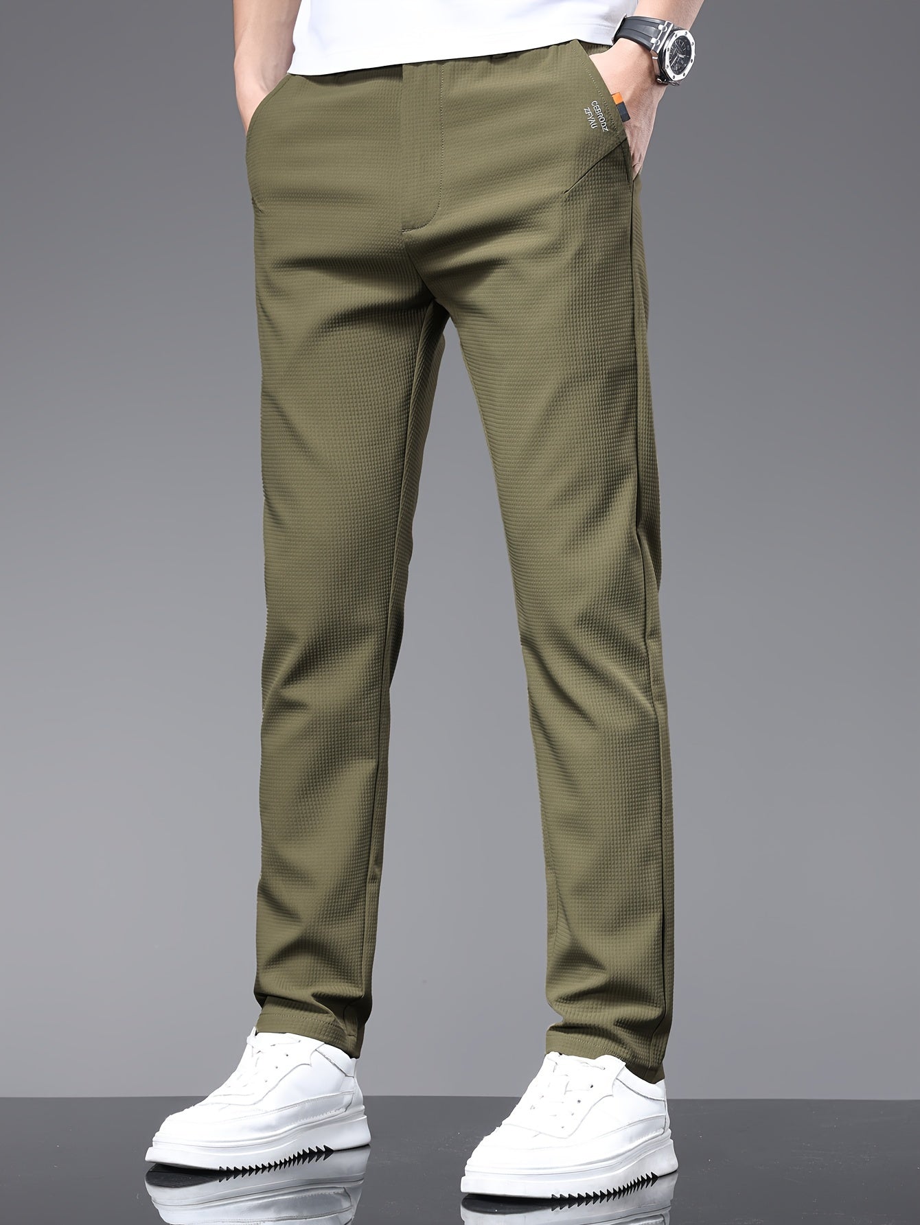 Men's slim fit pants with pockets, perfect for outdoor activities in spring and autumn.