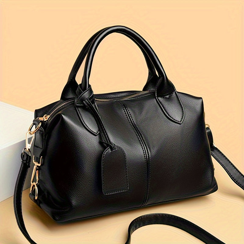 Stylish shoulder bag with removable strap and zip closure, perfect for everyday use.