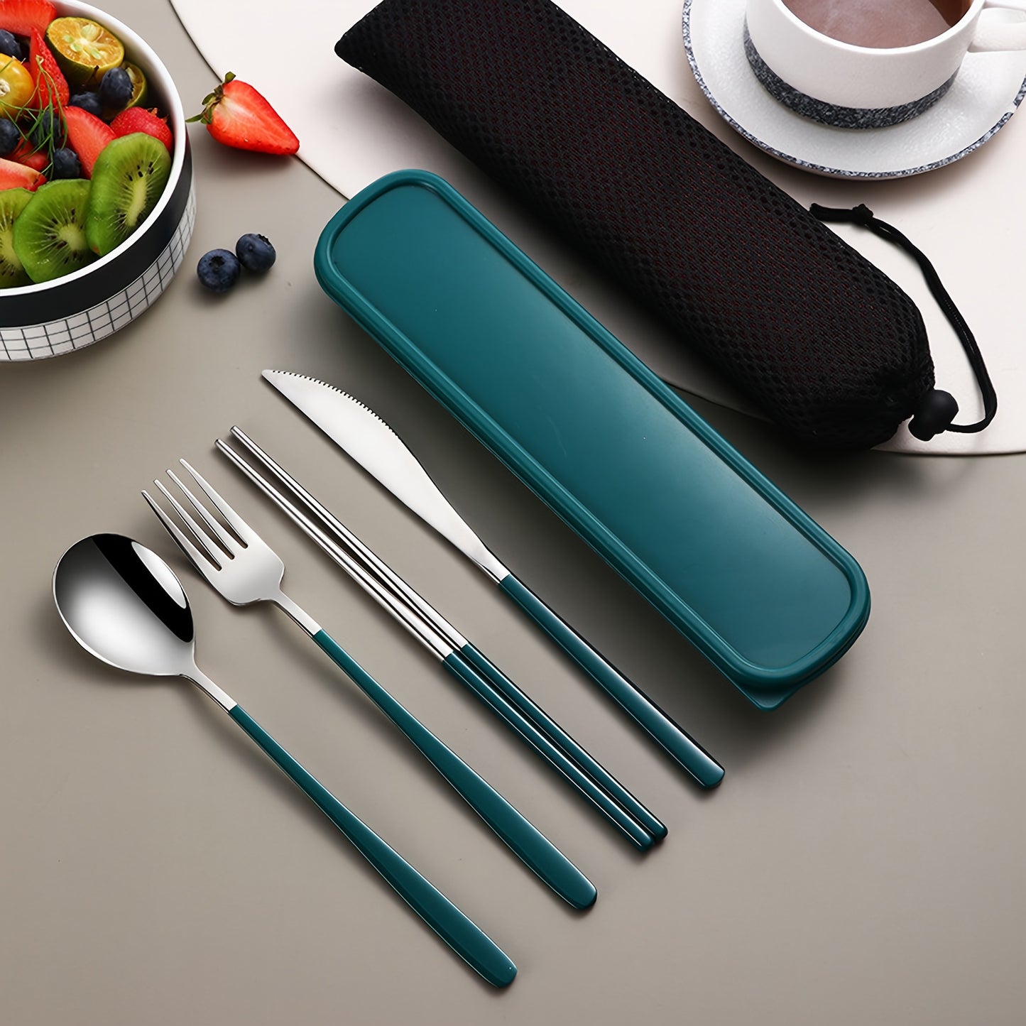 Stainless steel cutlery set includes knife, fork, spoon, and chopsticks in portable case for picnics, camping, lunches, and gatherings.