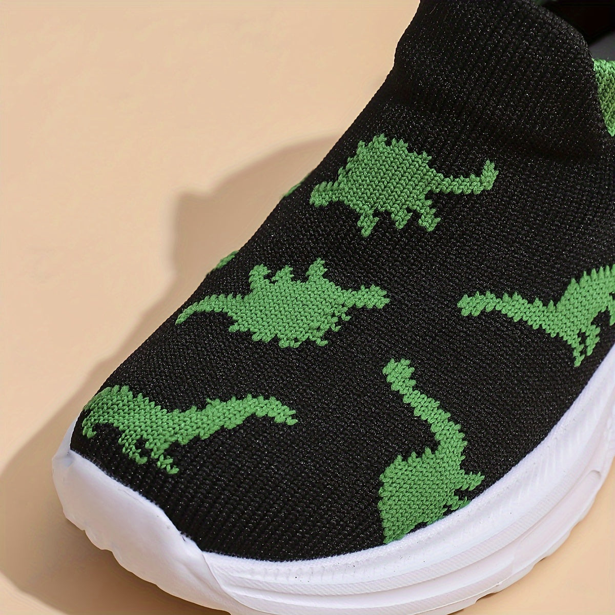 Children's knit dinosaur cartoon slip-on shoes are lightweight and breathable with a street-style design, perfect for toddlers all year round.