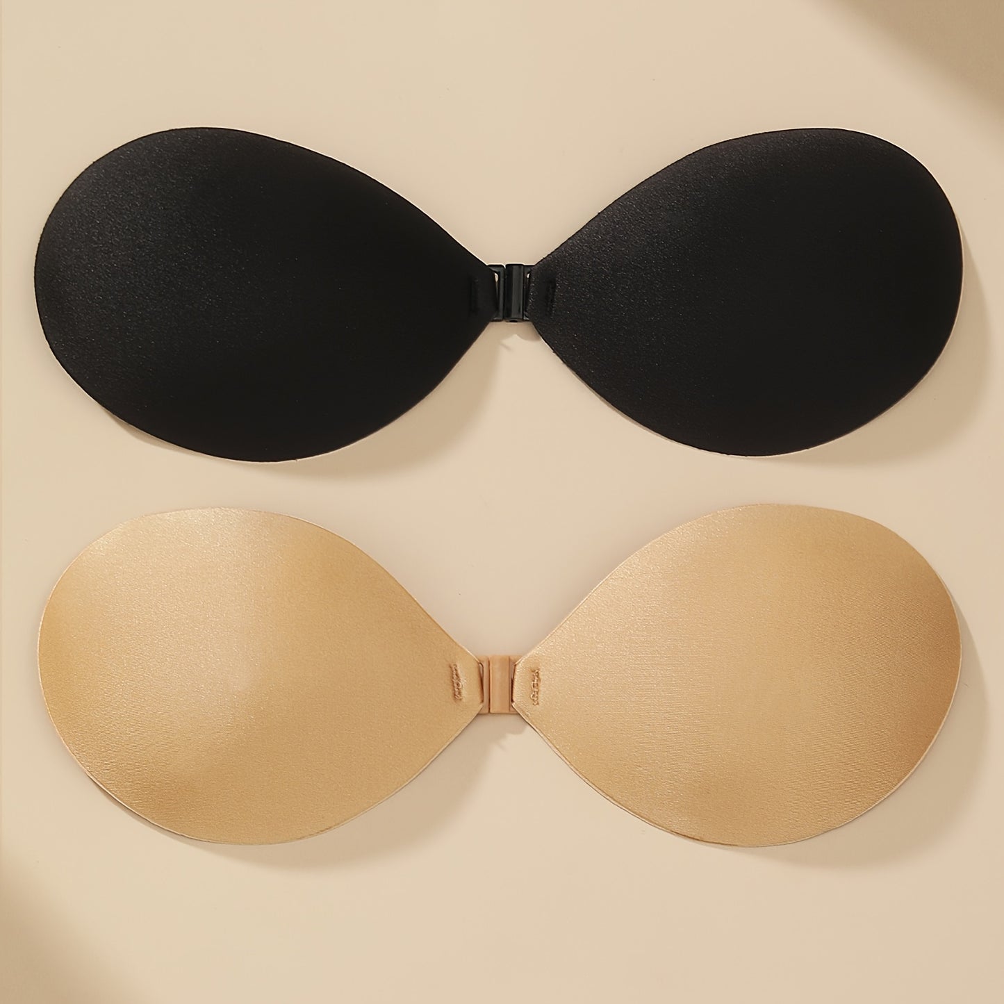 1 pair of invisible fold, reusable, and seamless women's bras for backless and strapless wear.