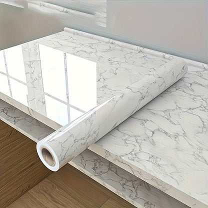 Roll of waterproof adhesive film with a marble pattern that is resistant to heat and oil. Ideal for lining kitchen and bathroom cabinets, drawers, and furniture during renovations. This non-food contact home decor solution is perfect for adding a touch