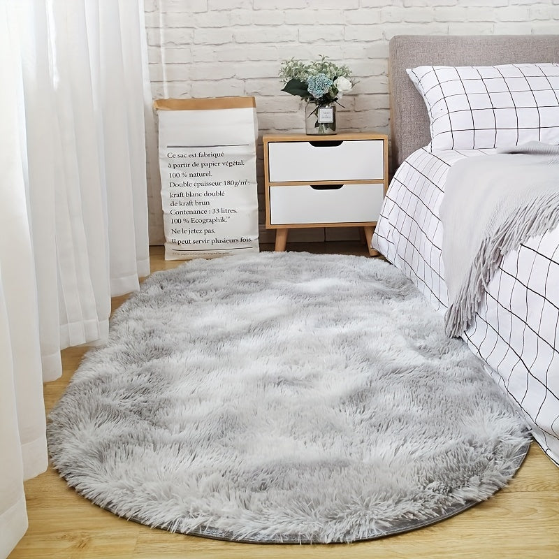 Soft and fluffy oval area rug, designed for use in living rooms, bedrooms, game rooms, and dormitories. Made of non-slip, washable polyester material. Machine-made shaggy rug perfect for adding a cozy touch to your space. Ideal for use as a bedside