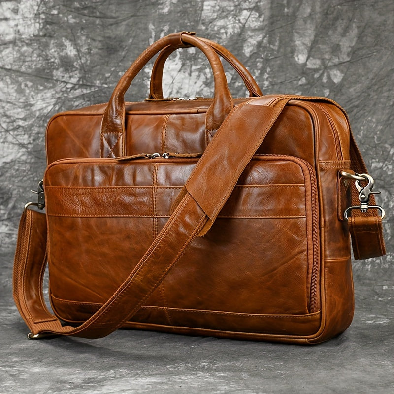 Men's genuine leather briefcase with laptop compartment, adjustable shoulder strap, zipper closure, and polyester lining for office and daily commute.