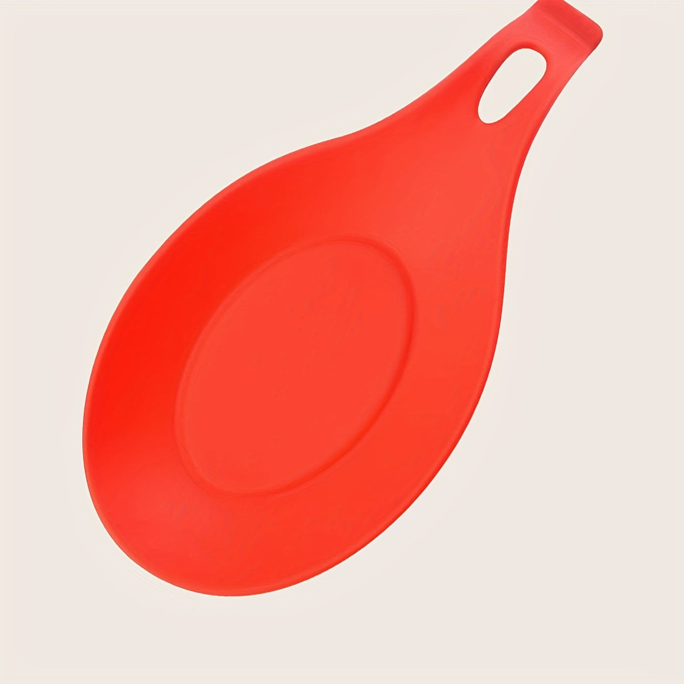 Durable, non-slip silicone spoon pad for kitchen utensils, heat-resistant and easy to clean.