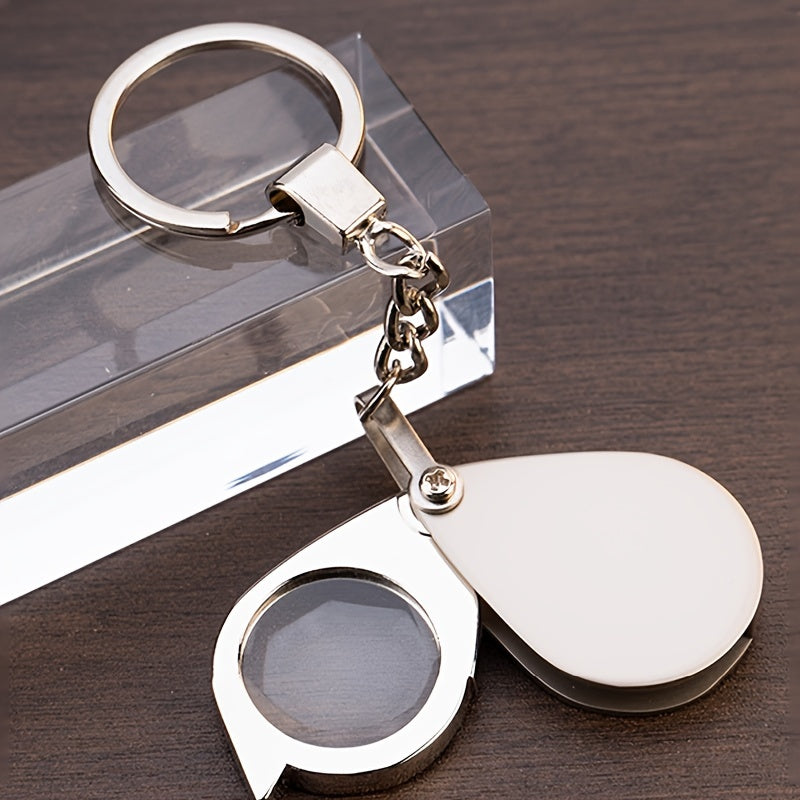 A premium gold keychain magnifying glass with high-definition glass, portable and foldable design perfect for reading small print.