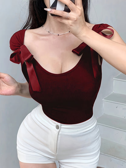 White backless bowknot shoulder crop top in stretchy polyester blend with ribbed texture. Perfect for all seasons.