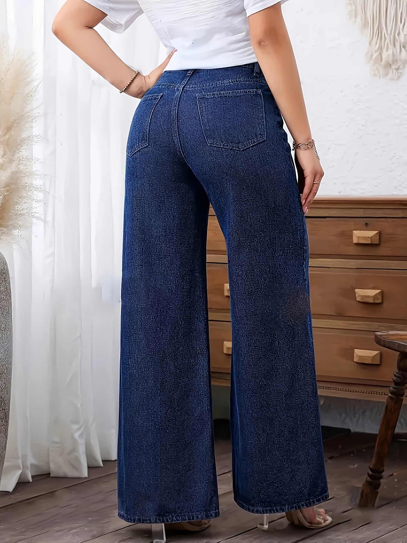 Women's plus size denim jeans with straight leg, solid color, medium stretch, washed fabric, and wide-leg design suitable for all seasons.