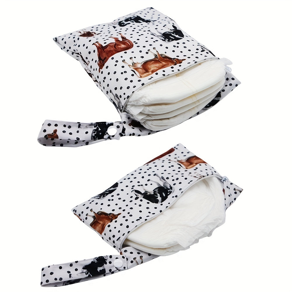 Set of 2 small waterproof wet bags with cow prints.