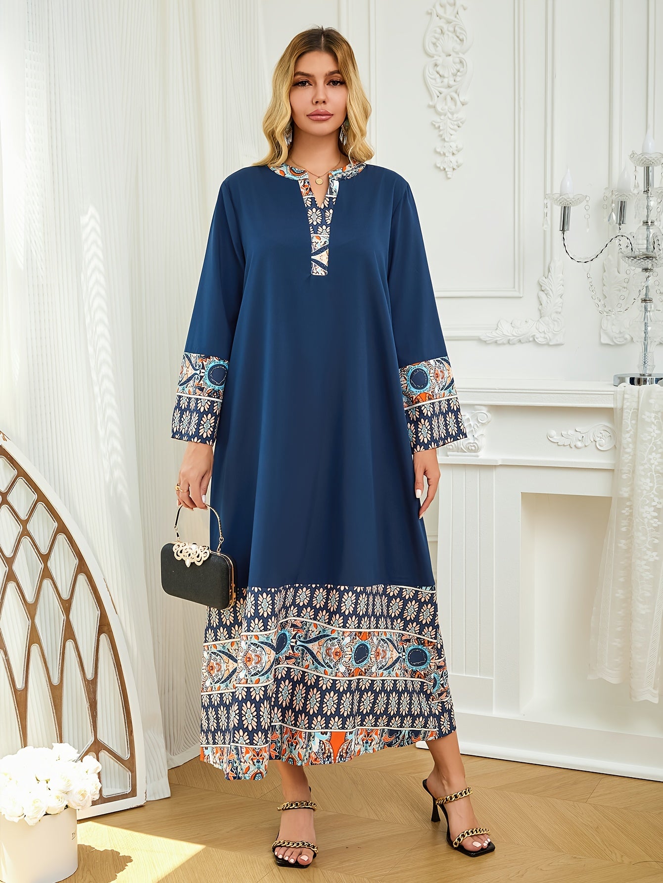 Elegant two-tone Muslim Abaya dress with paisley and floral design, blue long sleeves, polyester fabric, asymmetrical hem, and includes hijab. Ideal for all seasons.