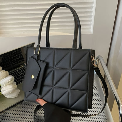 Black quilted synthetic leather tote bag with gold-tone hardware and detachable crossbody strap. Includes matching coin purse. Perfect for work, office, and everyday use. Ideal commuter