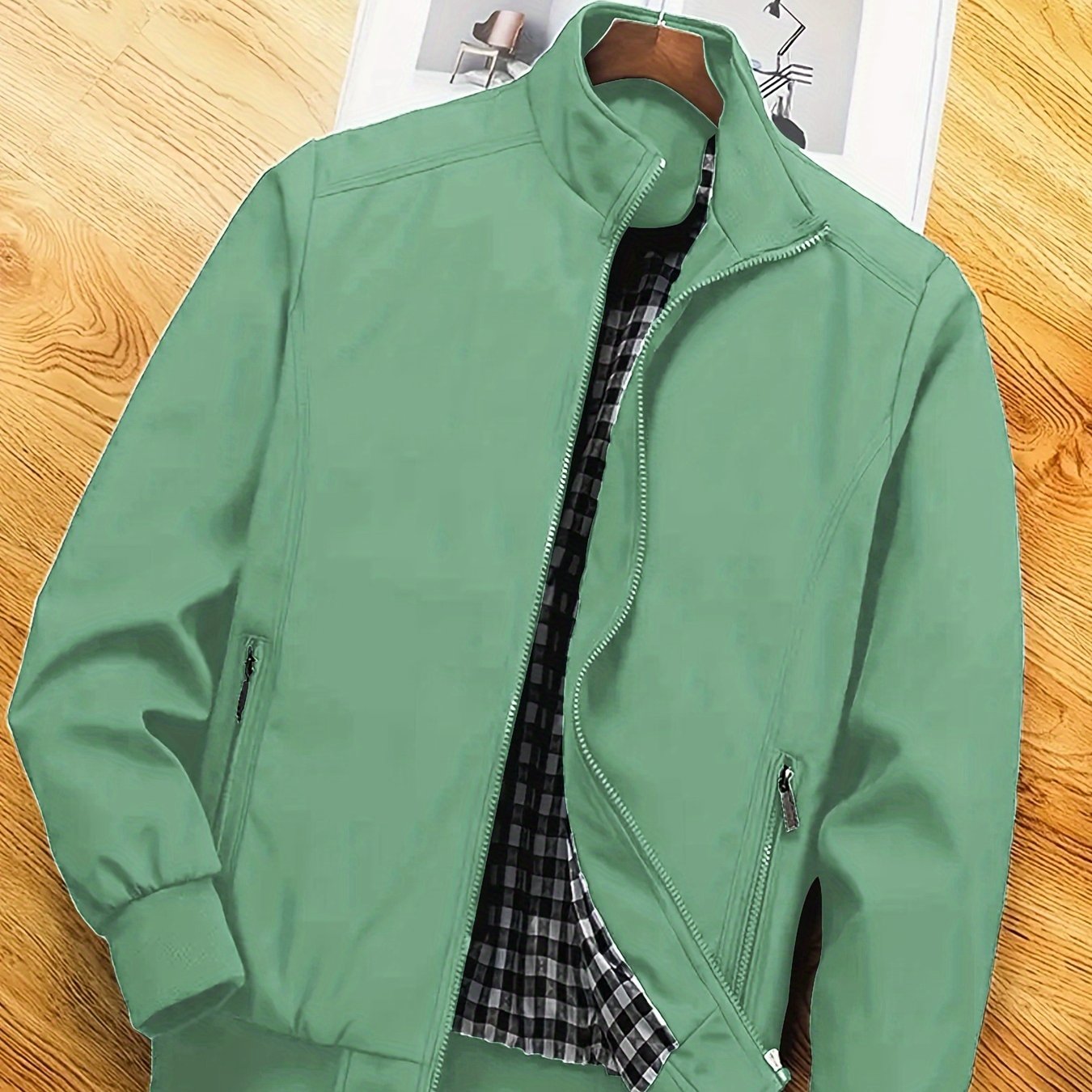 Men's casual spring/autumn polyester jacket with stand collar, zipper pockets, and solid long sleeves for outdoor and workwear.