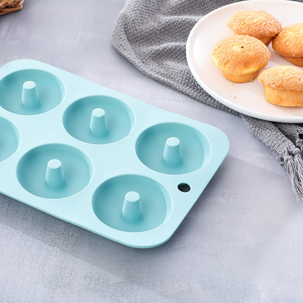 A 30-piece silicone kitchen baking supplies set includes nonstick silicone bakeware such as a baking pan, cake molds, baking sheet, donut pan, muffin pan, and cake pan, as well as a 24-pack of silicone cupcake mold baking cups.