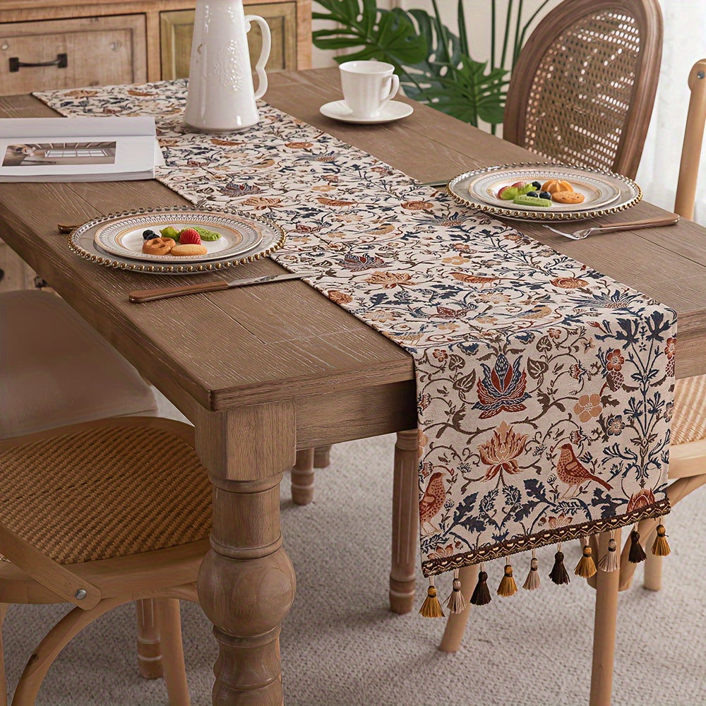 Vintage floral and bird jacquard table runner with tassels in rustic countryside style. Made of polyester, 33cm wide. Ideal for dining, coffee, and tea tables. Vintage design with polyester fabric.