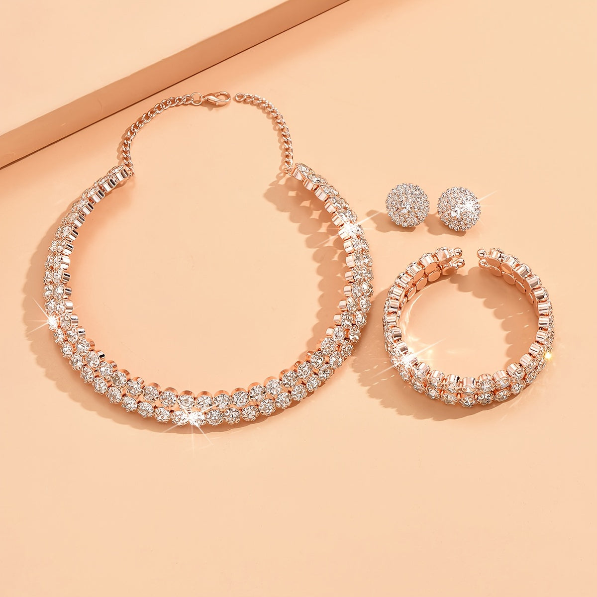 Elegant silver plated jewelry set featuring one pair of earrings, one necklace, and one bracelet all inlaid with shining rhinestones. Perfect for matching with daily outfits or as party accessories.