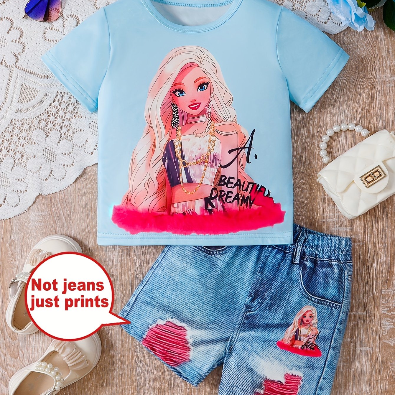 Cartoon print girls' short sleeve top and graphic shorts set, perfect for outdoor summer activities