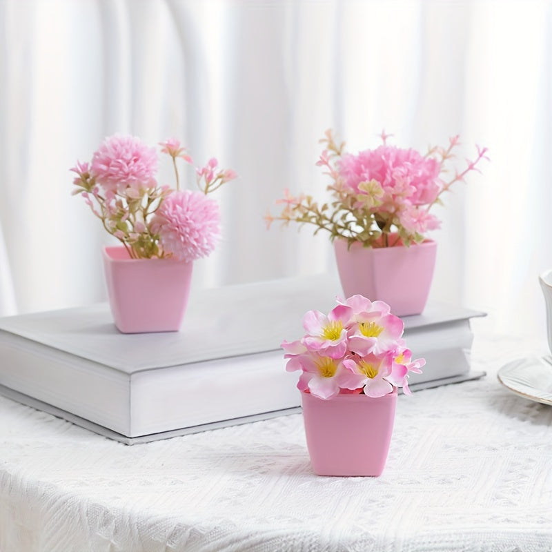 3-5 mini artificial potted pink flowers in plastic square pots, perfect for indoor décor on desks or bookshelves.