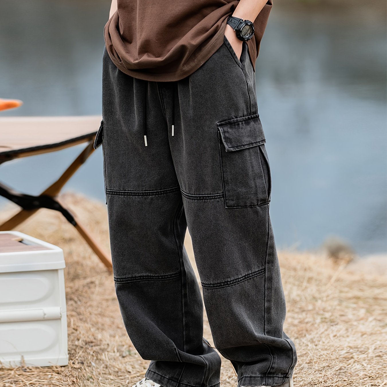 Men's cargo pants with multiple pockets and drawstring, ideal for outdoor activities in spring and fall.