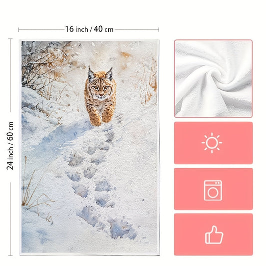 Two pieces of Lynx Snow Footprints kitchen towels, made of super absorbent polyester knit fabric. These towels are machine washable and feature a contemporary coastal style, measuring 40.64x60.96 cm. They are perfect as dish hand towels for holiday decor.