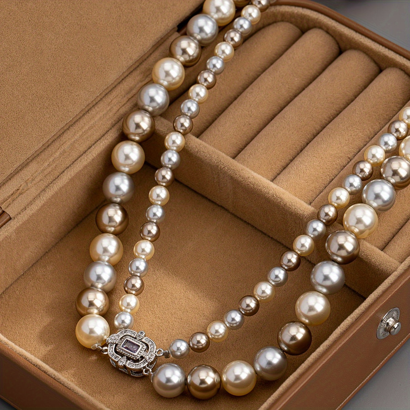 For special occasions and weddings, adorn yourself with our exquisite double-strand pearl necklace featuring 22K golden plating and a zirconia clasp. This elegant piece comes with detachable layered imitation pearls for a timeless and luxurious look.