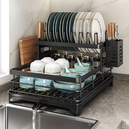 Black iron 2-tier kitchen dish rack with drainboard, utensil holder, cup hooks, and foldable design for space saving. Ideal for drying plates, bowls, pots, and cutlery.