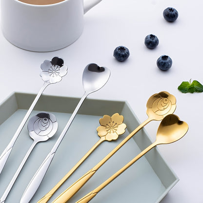 Four stainless steel cherry blossom coffee/dessert spoons.