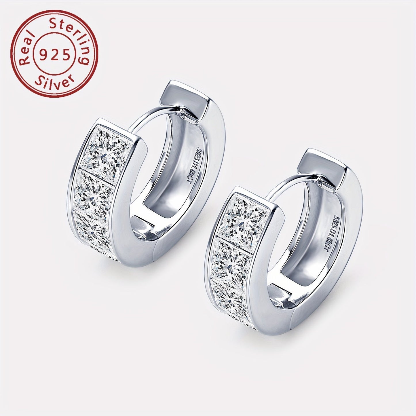 A set of elegant earrings featuring thick Moissanite stones set in 925 silver. These princess square cut earrings showcase an irregular design, creating a unique and eye-catching look. The pure silver earrings are lightweight at 5.5g and feature 8 pieces