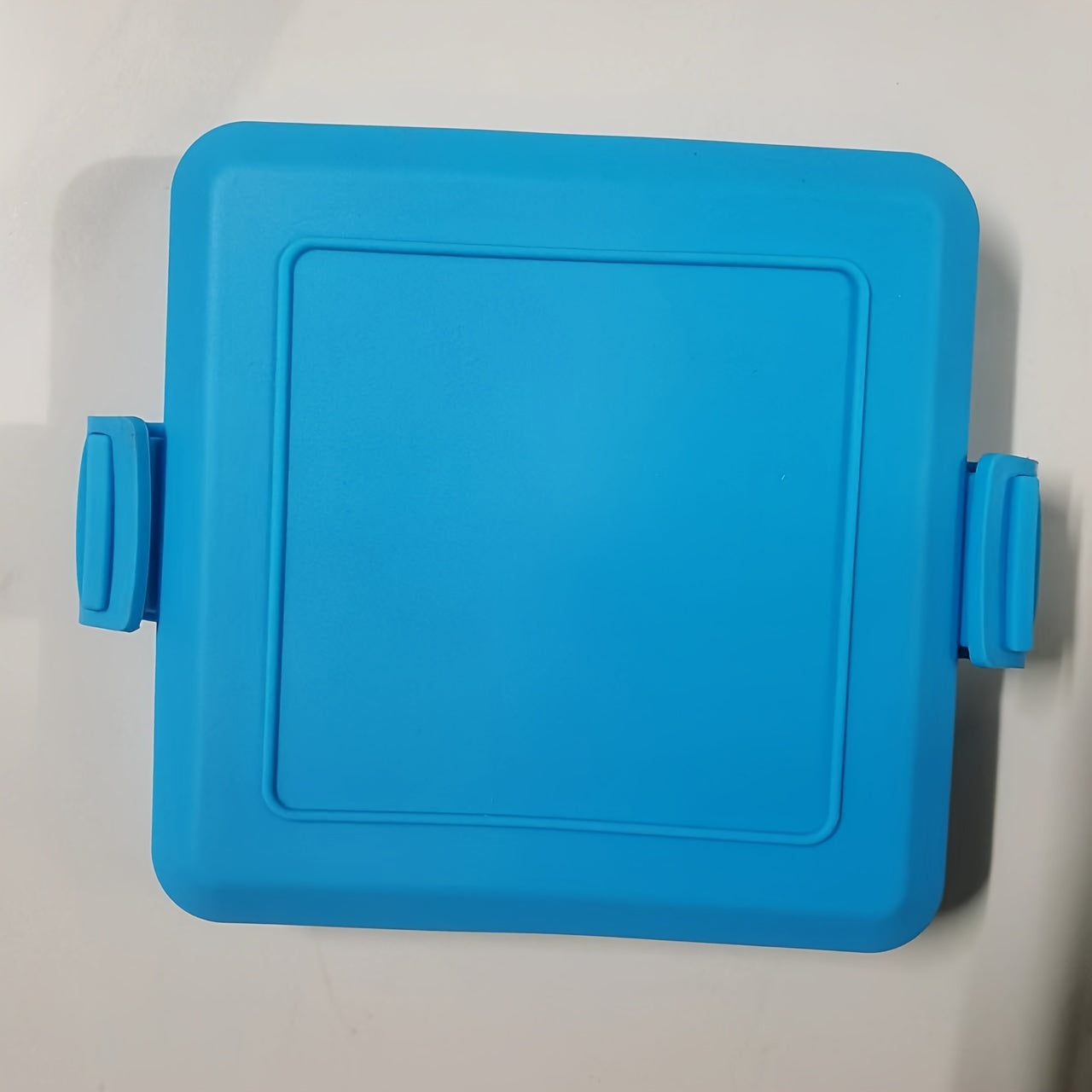 One piece Silicone Sandwich Maker featuring a removable non-stick surface, adjustable silicone straps for microwave toasting, dishwasher safe, no need for electricity, made of PFOA-free material, includes a lid.